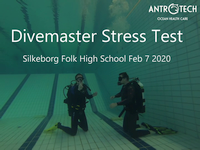 Two divers underwater preparing to exchange their gear