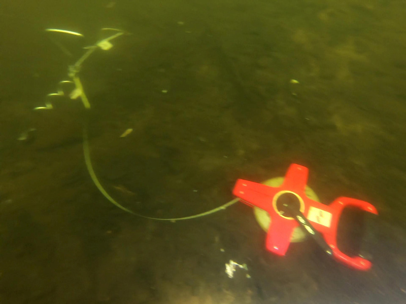 Measurement tape suspended at the lakebed to measure velocity