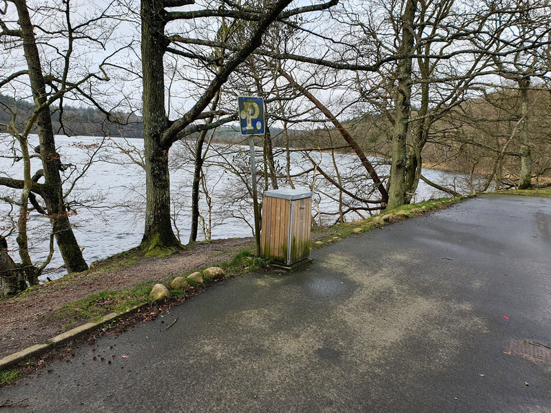 Entry behind this waste bin